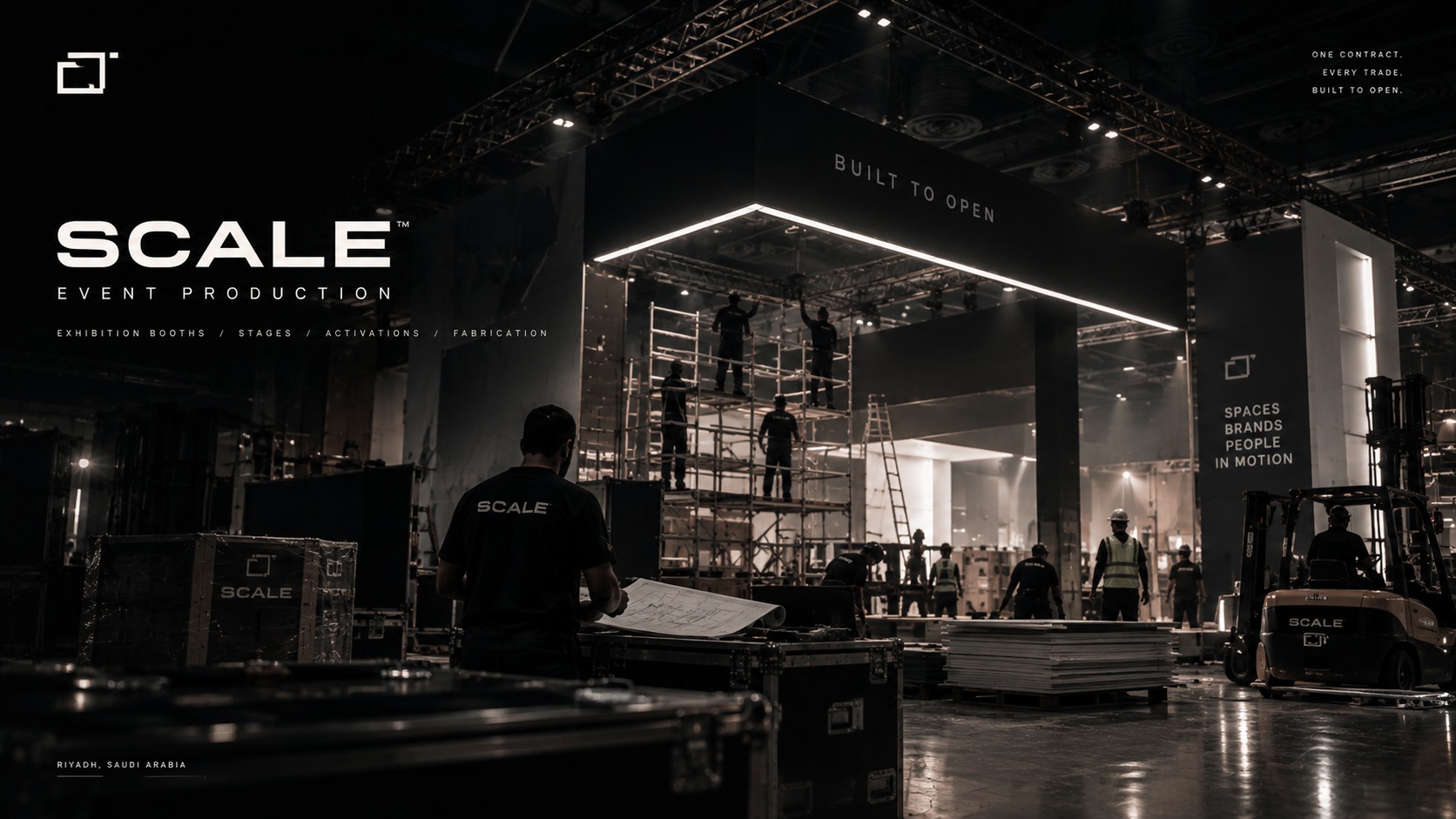 Scale Event Production — crews building an exhibition structure, built to open